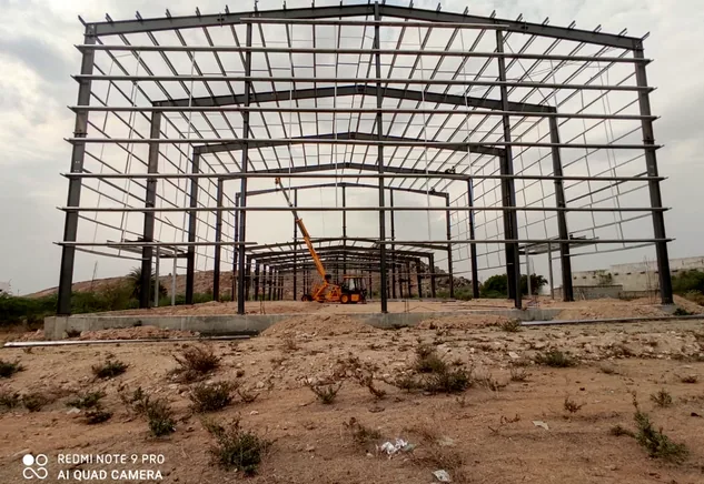 Industrial PEB primary frame erection on open ground