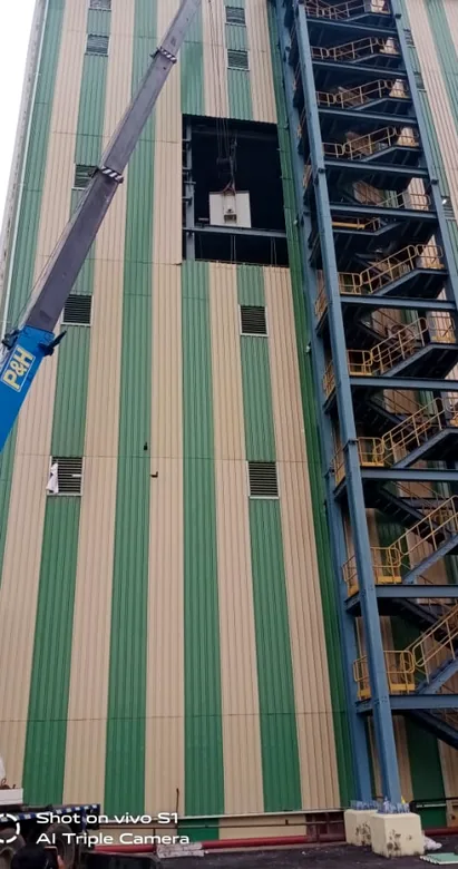 Tall industrial tower with panel cladding